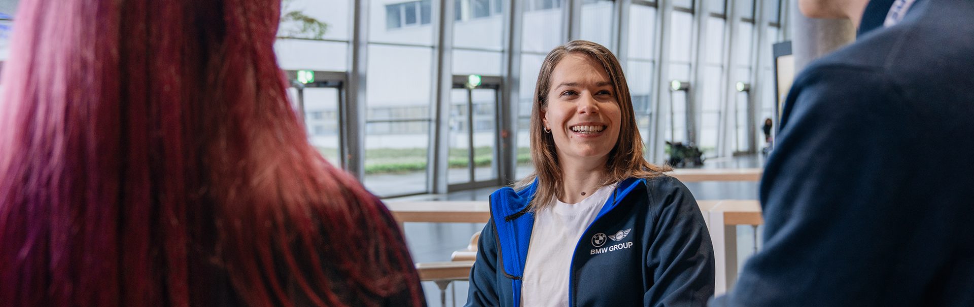 A recruiter is giving application tips to two candidates