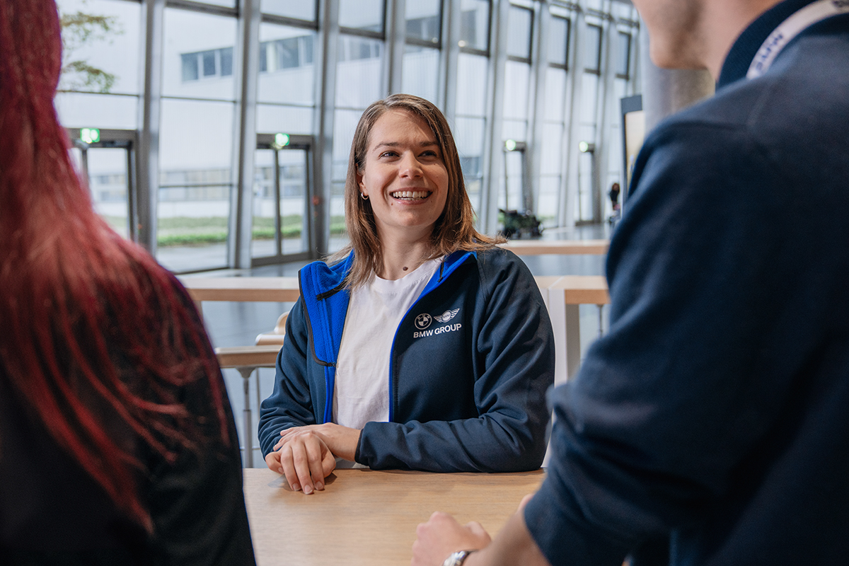 A recruiter is giving application tips to two candidates