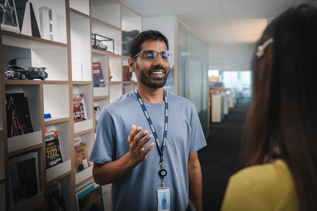 A colleague in a conversation with others