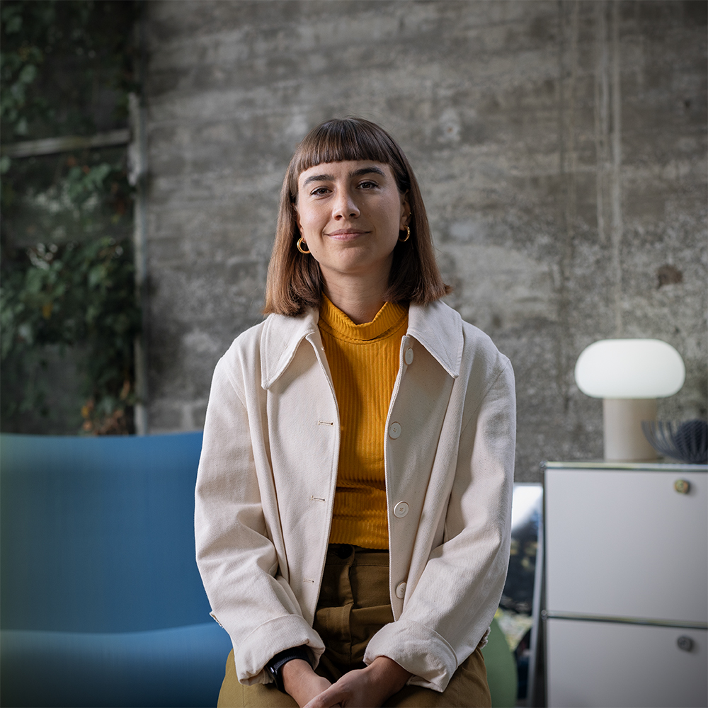 Portrait of a sustainability expert in a modern setting.