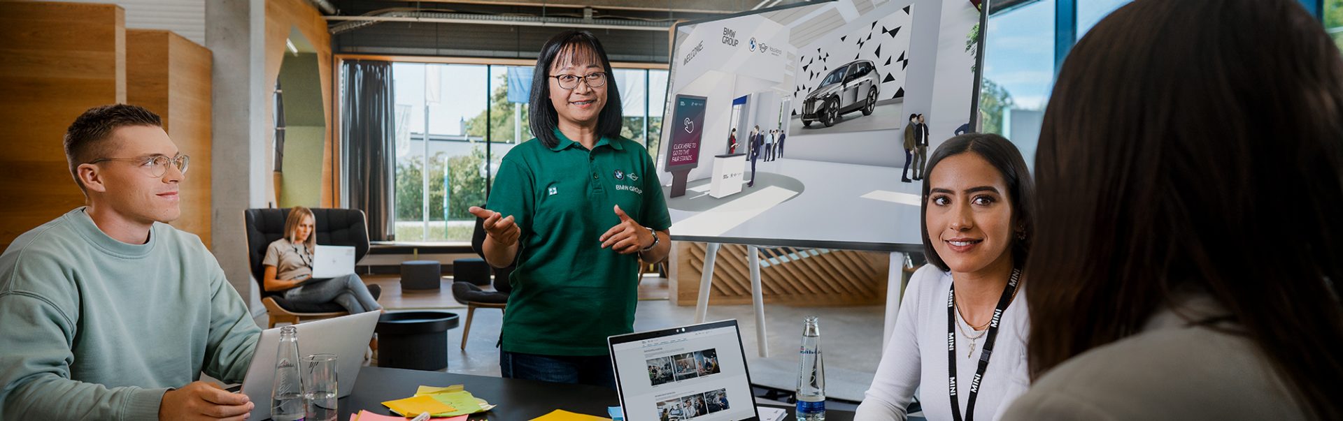 Four BMW Group employees planning an event.