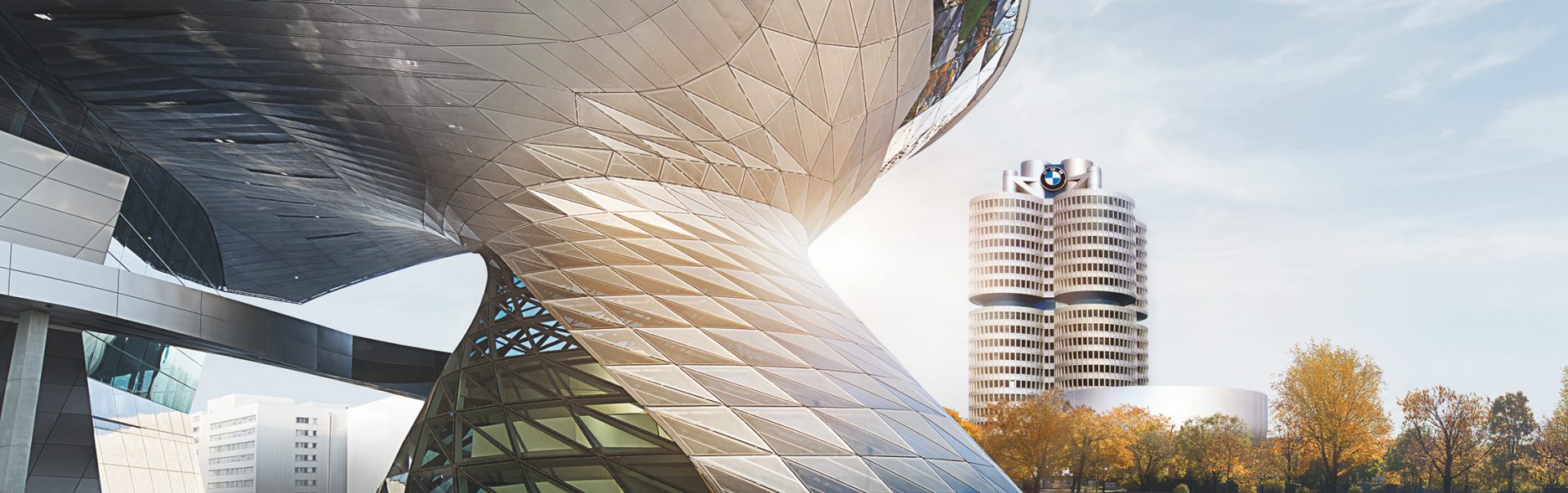 Extorior view of the BMW World with the BMW Four-Cylinder in the Background.