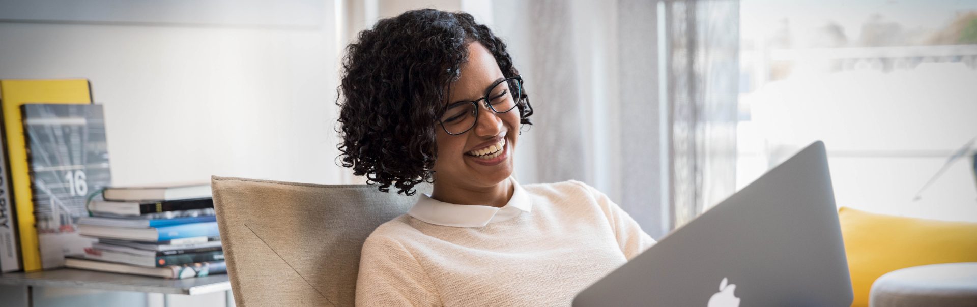 Colleague with laptop laughing