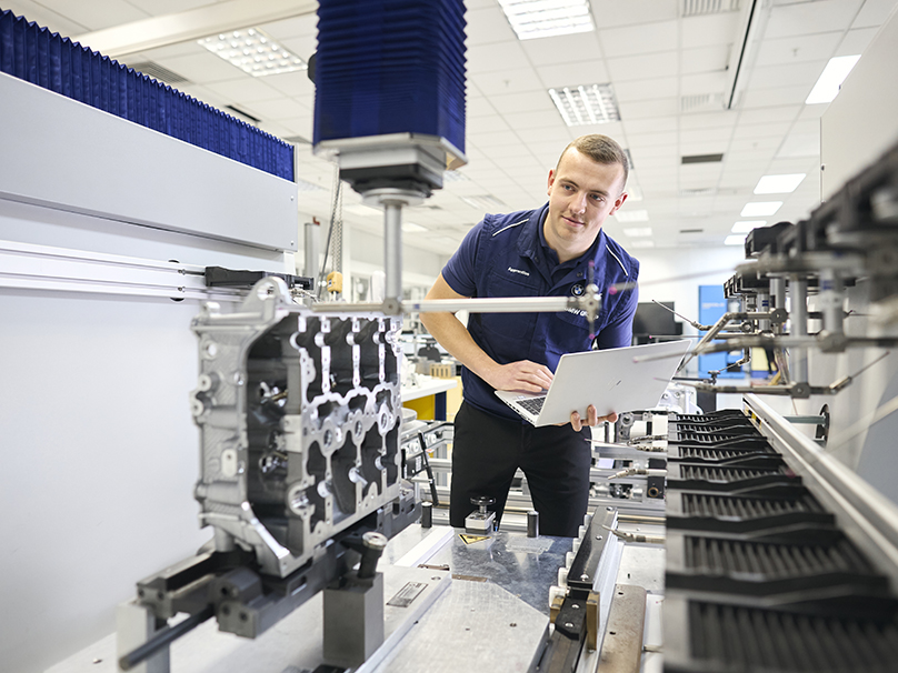 A young man working during his apprenticeship at BMW Group UK