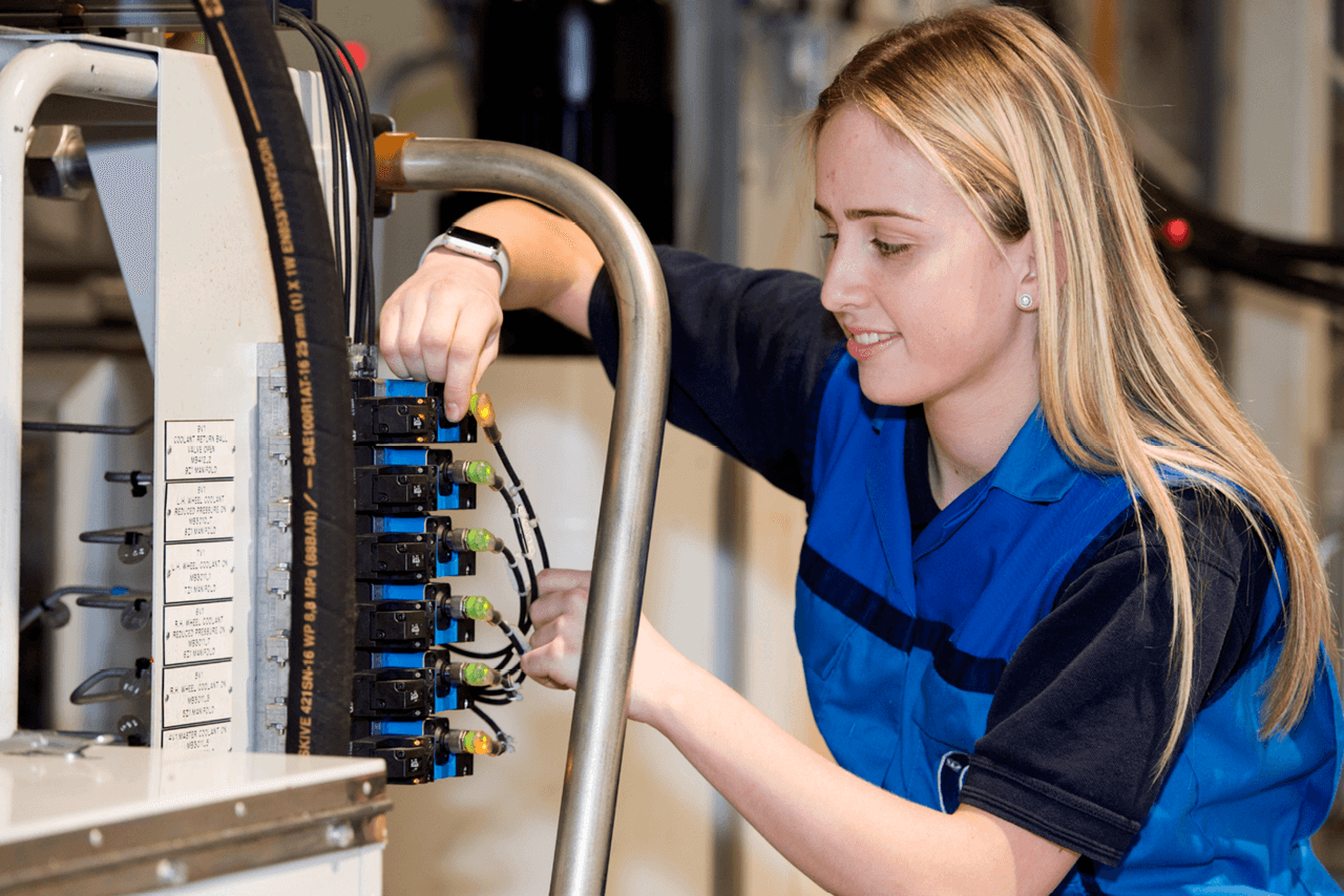 Maisie McDonnell, a maintenance apprentice at BMW Group Plant Hams Hall during her work