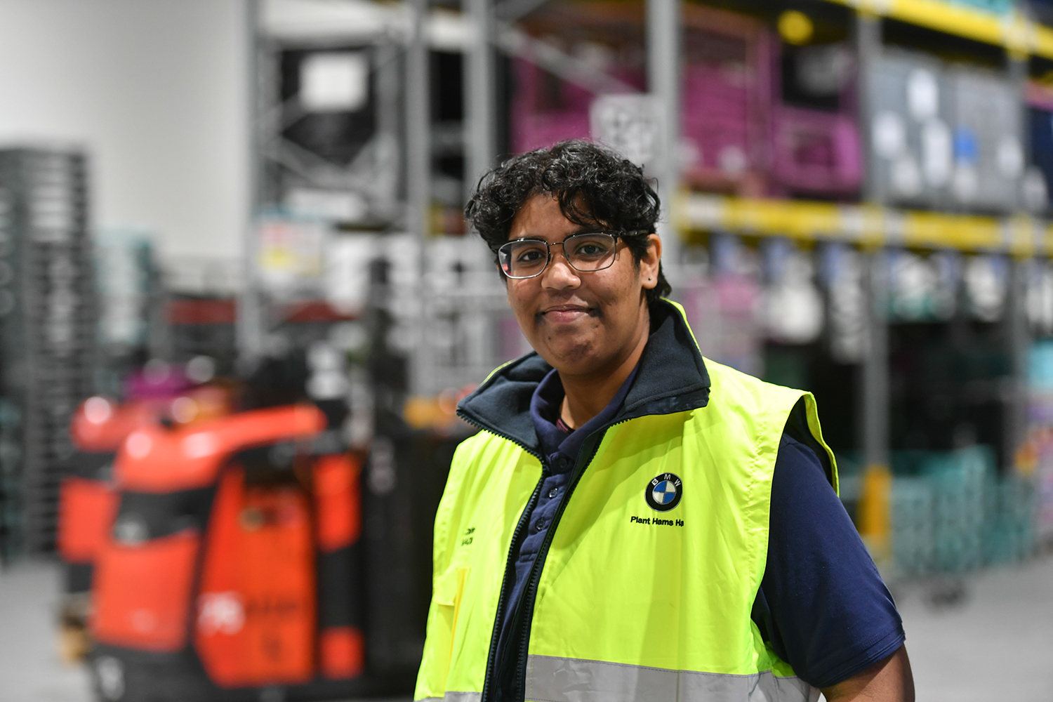 Intern Zahra, standing in the logistics centre at Plant Hams Hall