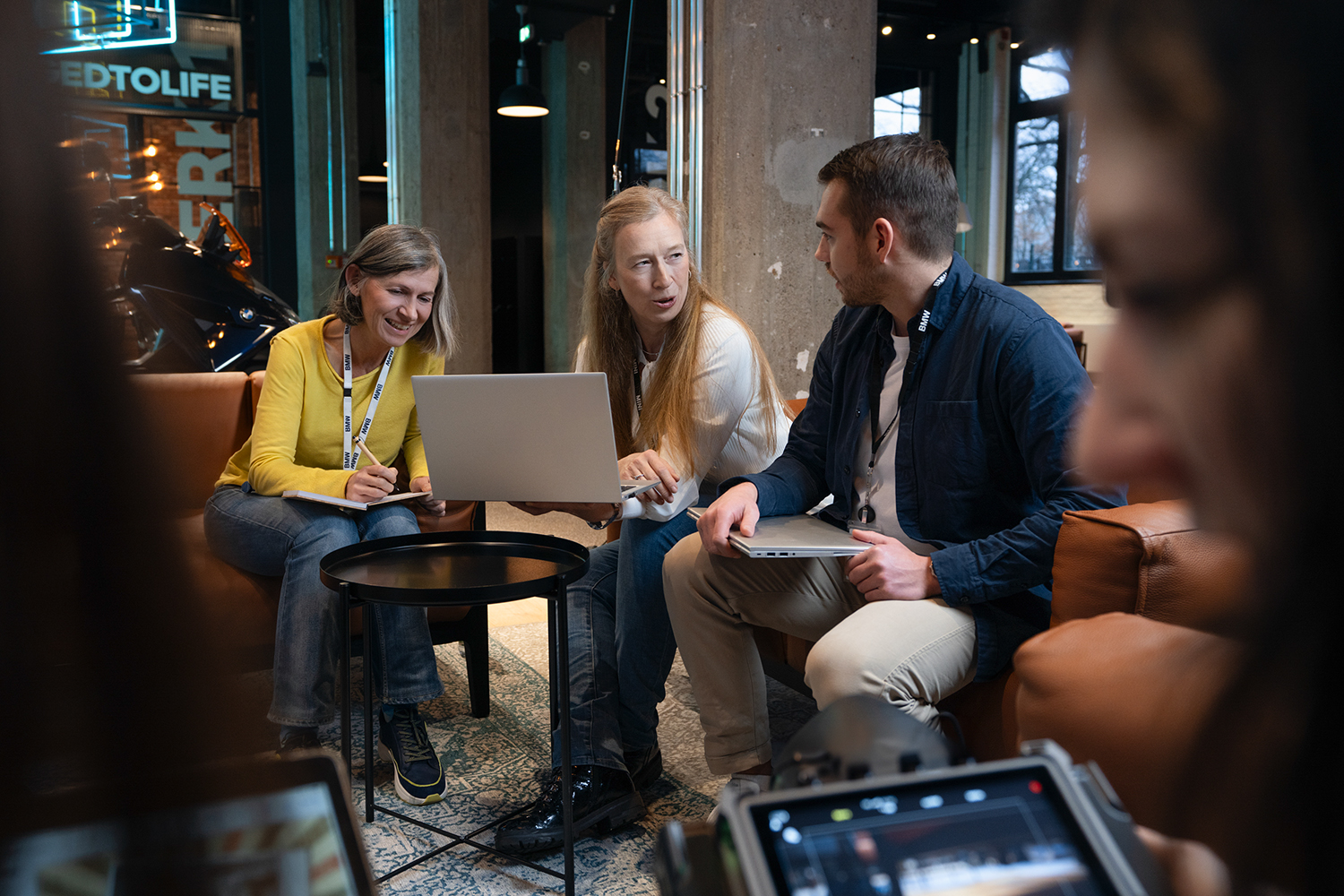 Three colleagues talking about benefits