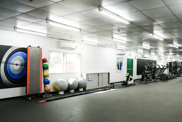 The picture shows a fitness room offered for the employees.