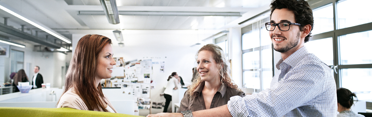 The image shows two women laughing.