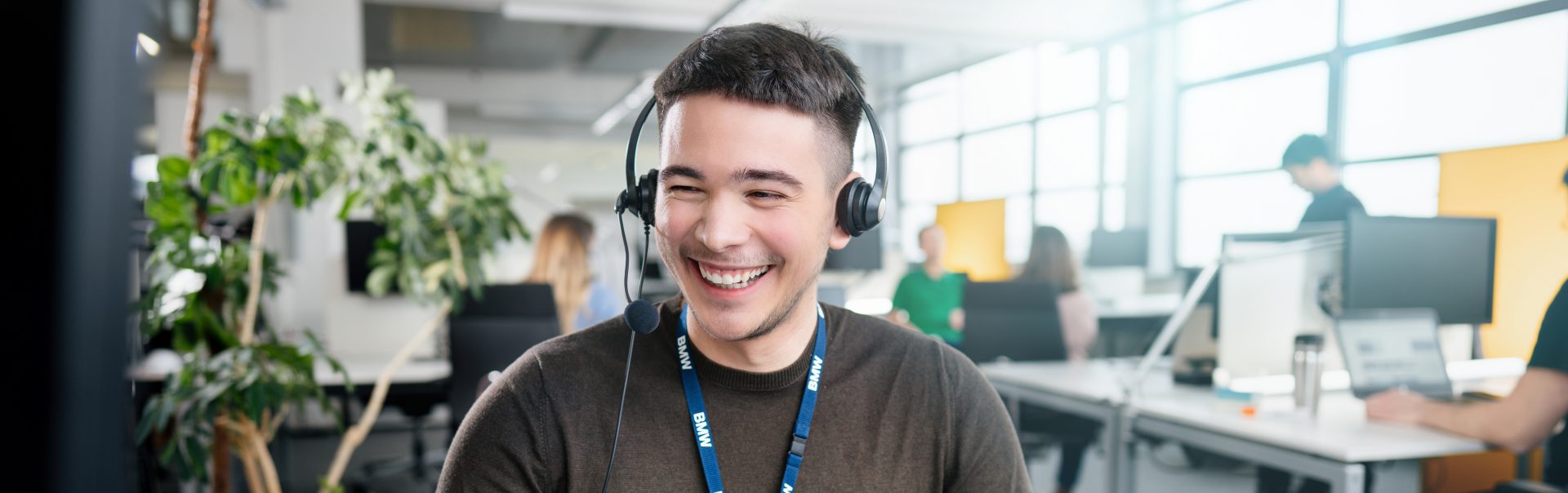 The image shows a man in a telephone conference.